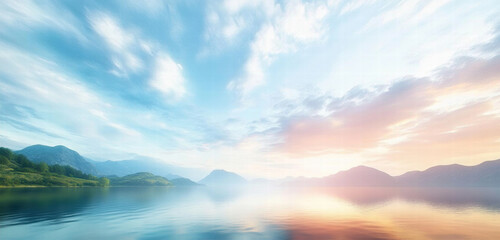 Fototapeta premium Tranquil Sunrise Over Serene Lake with Reflections, Surrounded by Green Hills and Mountains Under a Soft Pastel Sky - Perfect for Nature and Landscape Themes