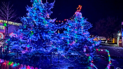 New Year's installation. Christmas photo zone. A large beautiful New Year's toy glows with Christmas lights.