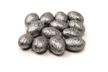 Chocolate silver eggs isolated on a white background.