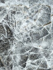 Ice crust on the pavement, paving stones, frozen water on a pavers