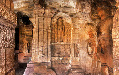 Many ancient sculptures inside the abandoned 7th century cave temple in India