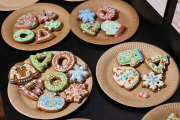 Beautifully and Festively Decorated Holiday Cookies Placed on Plates for Everyone to Enjoy