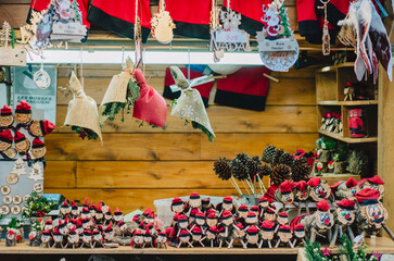 Traditional Christmas market stall with caga tio figures and festive crafts
