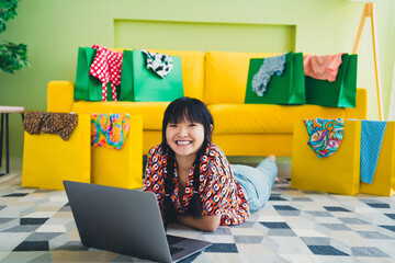 Full body portrait of nice young girl use laptop buy shop bags free time modern interior flat indoors