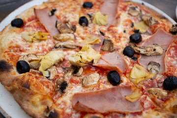 Large pizza with mushrooms and ham.