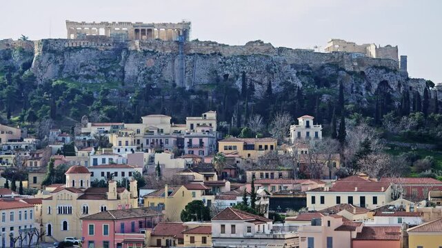 Panoramic view of Athens traditional architecture houses at Plaka and Acropol ancient complex on top of the hill