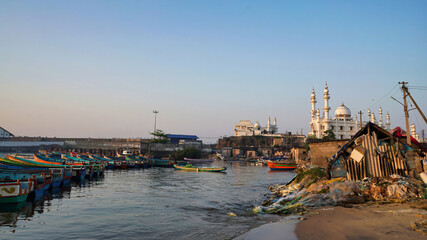 tiny Boats on the sea overlooking Thekkumbhagam Juma Masjid