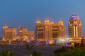 Naklejka premium Doha, Qatar October ‎9, ‎2024: A view of Katara Park and Doha Towers with beautiful colors of the sky