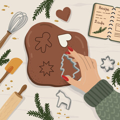 In the kitchen with baking supplies, a woman shows the process of making Christmas ginger cookies and treats.