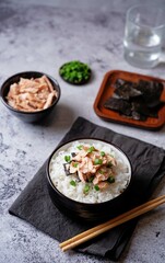 Rice bowl with salmon flakes, nori and scallion