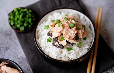 Rice bowl with salmon flakes, nori and scallion