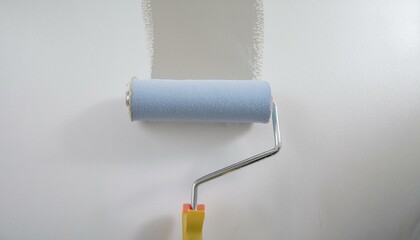 Obraz premium Roller applying paint to wall, scene of smooth rolling on wall