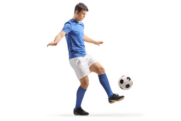 Football player in a blue top and white shorts kicking a ball © Ljupco Smokovski