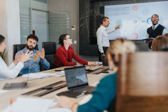 A diverse group of business people engaged in a collaborative meeting, discussing strategies and brainstorming solutions in a modern office setting. The image reflects teamwork and cooperation.