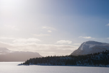 fog over a frozen lake in sweden