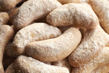 Closeup of homemade Christmas cookies called Kipferl or vanilla crescents coated in sugar