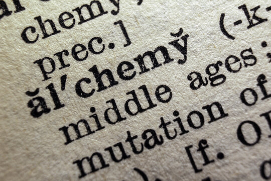 Word alchemy on dictionary page, macro close-up