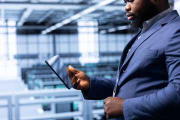 Employee with expertise in disaster recovery planning and security protocol enforcement working in...