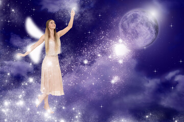 Enchanting fairy casting lights in dark sky with full moon. Beautiful girl with wings