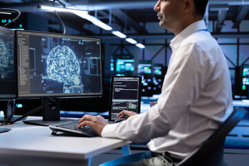 Computer scientist using AI tech on computer to do checkup in server room providing storage. IT professional in data center using PC to enable artificial intelligence to process datasets for training