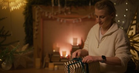 A Joyful Woman Preparing Christmas Presents Is Happy About the Upcoming Holidays