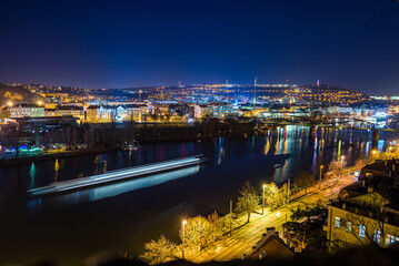 Fototapeta premium Prague, Czech republic - February 23, 2022. Night panorama of Vysehrad towards to Smichov and Cisarska louka area
