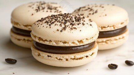 French macarons with coffee beans on marble background showcasing delicious pastry and gourmet coffee pairing.