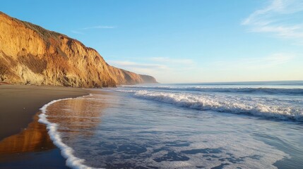 Serene beach landscape with gentle waves lapping against the shore at Hug Point near an autumn creek waterfall in a peaceful coastal setting