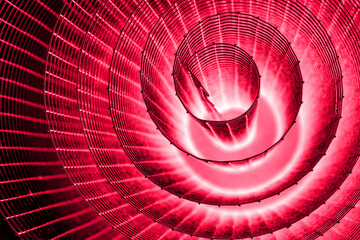 Abstract spiral with glowing pink purple wire texture against a black background, symbolizing color...