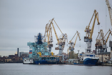 Construction of new ship and cranes