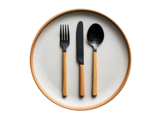 Elegant black cutlery set arranged on a minimalist round plate with natural wood accents in a modern dining setting