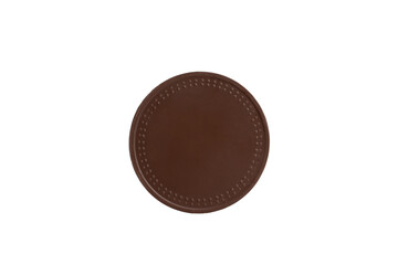 Chocolate medallion with a decorative edge isolated on a white background.