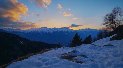 A serene sunset over snow-covered mountains, showcasing nature's beauty and tranquility.