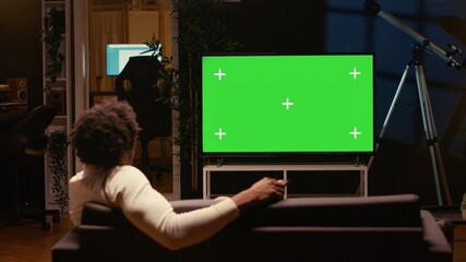 Person using chroma key video projector to binge series on subscription based streaming services....