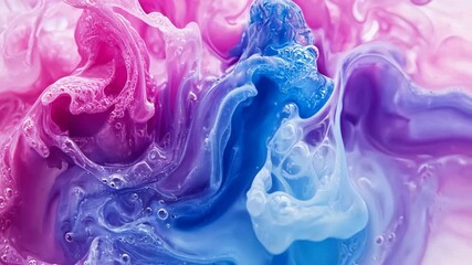 Swirls of vibrant colors mix in a mesmerizing abstract pattern