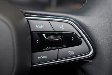 Naklejka premium The modern cars steering wheel control panel boosts convenience and performance