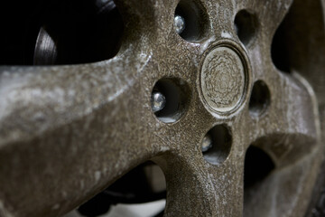 Closeup shot depicting a Dirty Car Wheel that is covered with Mud and Grime buildup