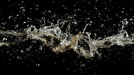 Obraz premium A high-energy splash of water frozen mid-motion, sparkling droplets suspended in the air, crisp and refreshing, ideal for dynamic or hydration-themed content. 