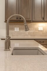 Modern kitchen sink and faucet detail.
