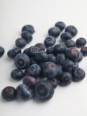 Heap of blueberries on white background