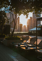 Morning Light Filtering Through Rooftop with Bangkok Skyline in the Background