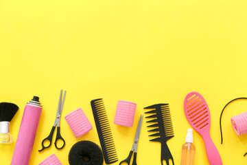 Set of hairdresser's accessories on yellow background