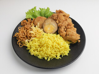 Saffron Rice served with fried chicken on a plate