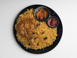 Biryani Rice served with fried chicken on a plate