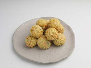 Takoyaki balls or noodle balls piled on a plate
