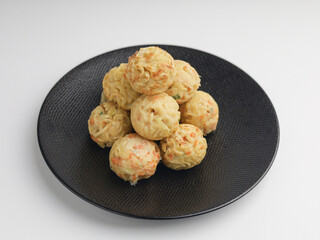 Takoyaki balls or noodle balls piled on a plate