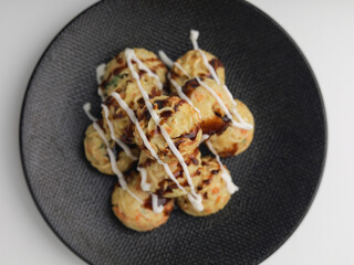 Takoyaki balls or noodle balls piled on a plate