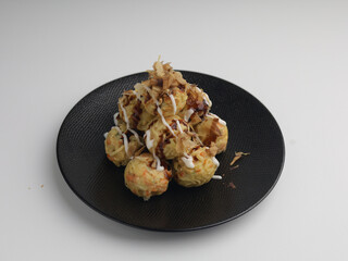 Takoyaki balls or noodle balls piled on a plate