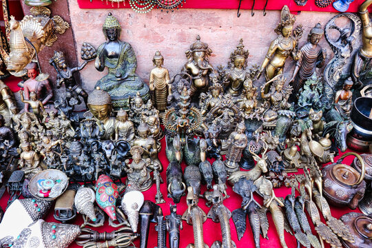 Assortment of Buddhist statues and idols as souvenirs at a tourist shop in the Swayambhunath chaitya temple complex in Kathmandu,Nepal 
