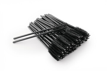 Black eyelash brushes on white background, beauty accessories, eyelash extensions, eyelash lamination